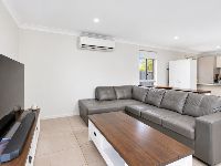 2 bradman-drive-woongarrah-16-furnished-living-room