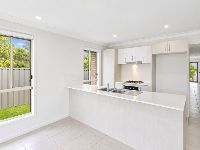 2 bradman-drive-woongarrah-07-kitchen-with-breakfast-bar