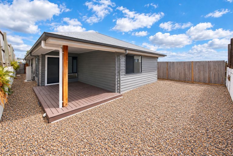 Modern Gravel Yard with Covered Patio