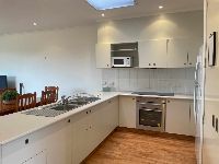 Unit kitchen-with-fridge_-kitchen-appliances-and-wooden-flooring
