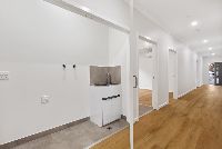 Kitchener   Unit-1-European-Laundry-and-Hallway-LR-No-Logo