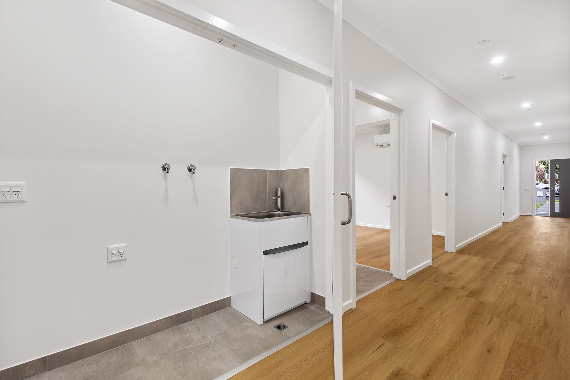 Kitchener   Unit-1-European-Laundry-and-Hallway-LR-No-Logo