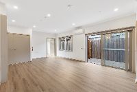 Freda   Unit 1 Living Dining onto Courtyard LR No Logo