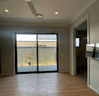Vacant bedroom, showing private patio