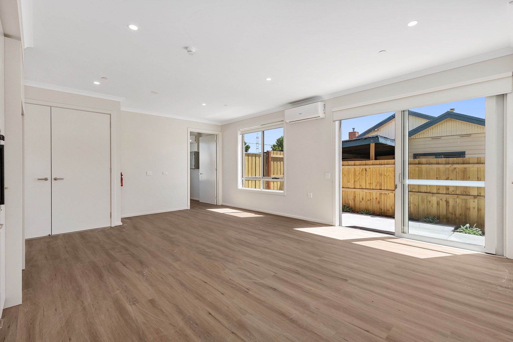 Langford   Unit 2 Living Dining onto Courtyard LR No Logo