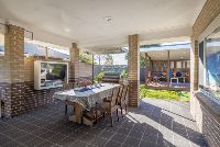 Outdoor dining-area-with-BBQ_-outdoor-seating-and-view-of-the-pergola