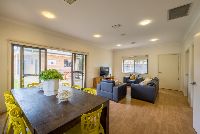 Living room-with-dining-table_-couches-and-tv-unit