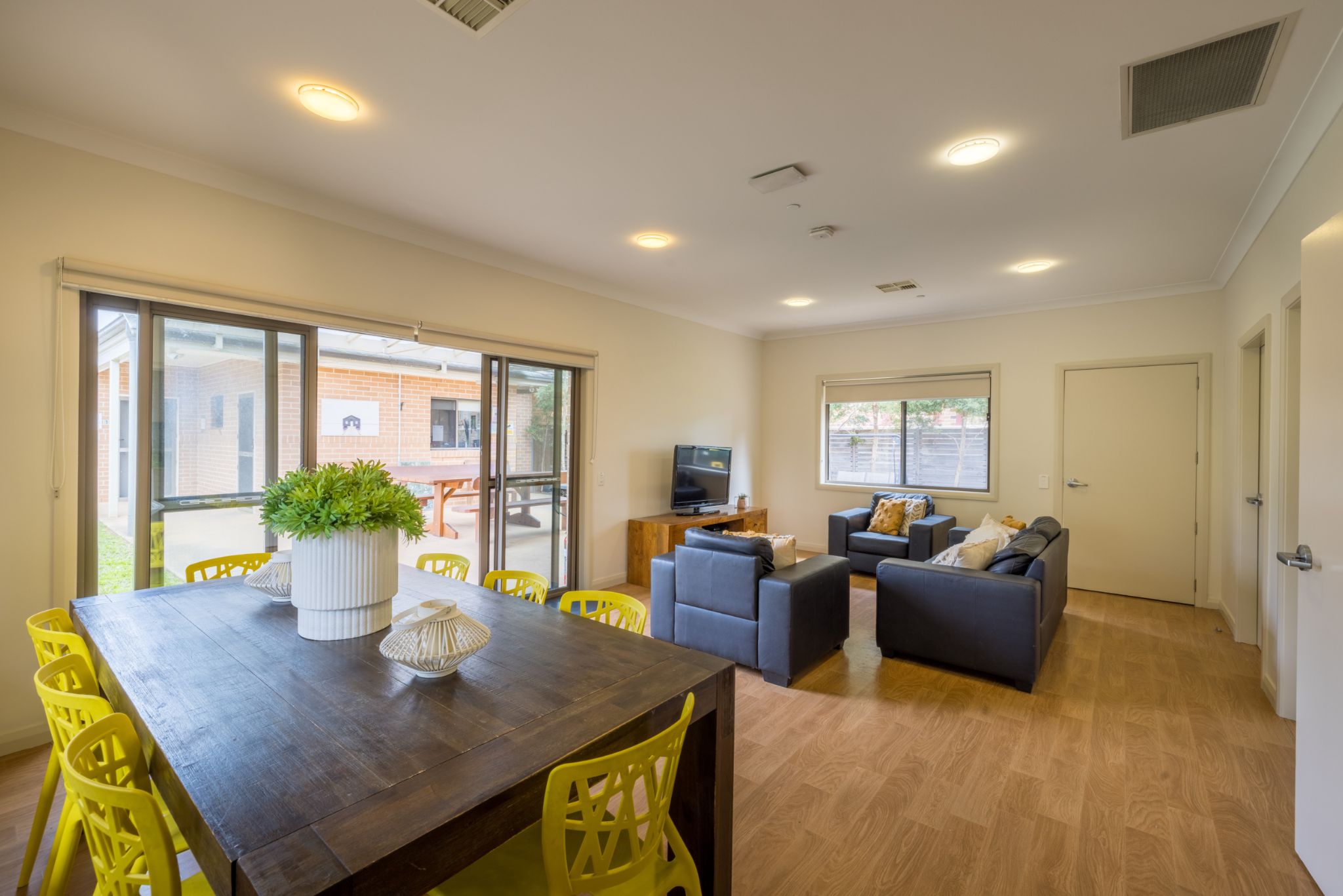 Living room-with-dining-table_-couches-and-tv-unit